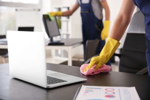 What Is Office Cleaning? | person cleaning desk