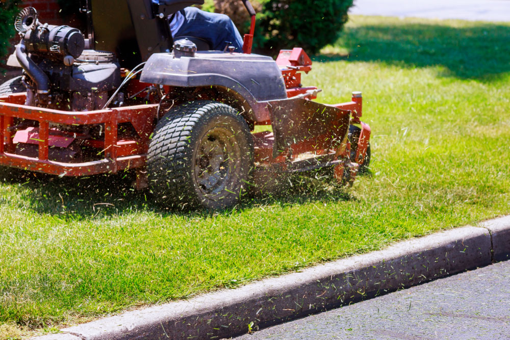 Office Cleaning Company | Mowing a lawn