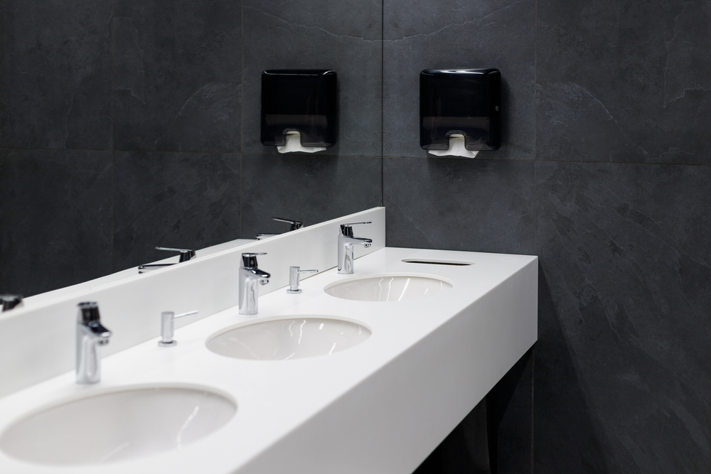 Washroom Hygiene Services | sleek modern looking sinks in a work bathroom